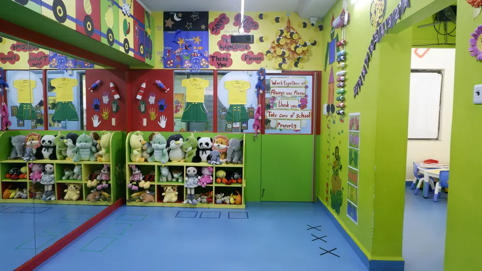 Cubs Gurukul activity hall with soft-toy shelves and decorated walls