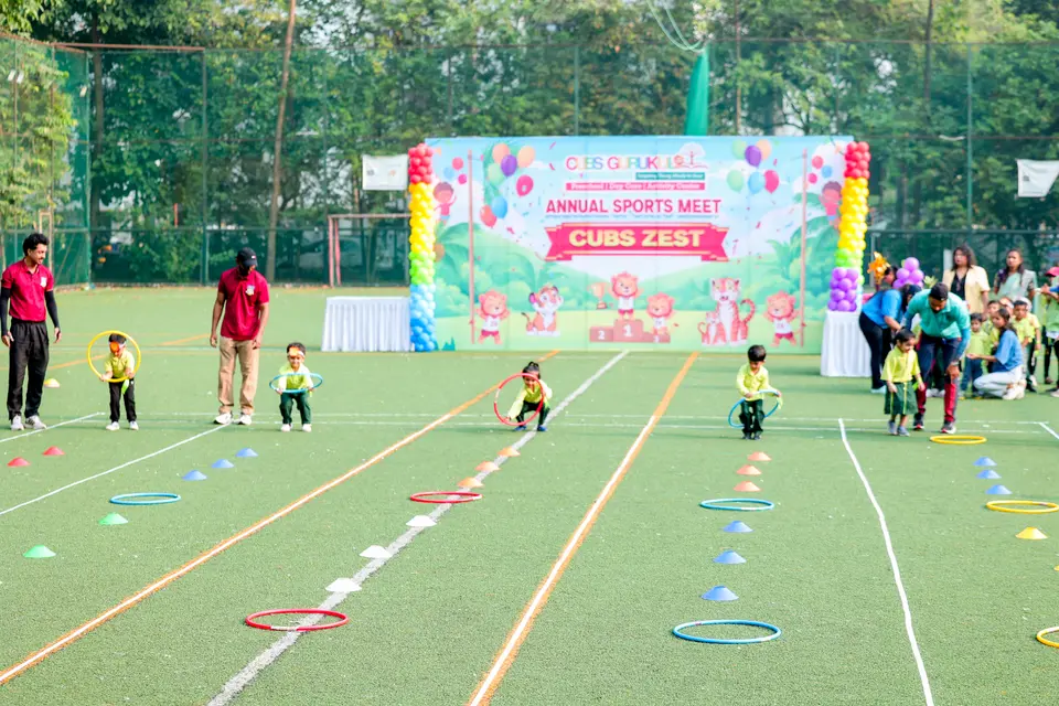Children racing at the Cubs Gurukul Annual Sports Meet